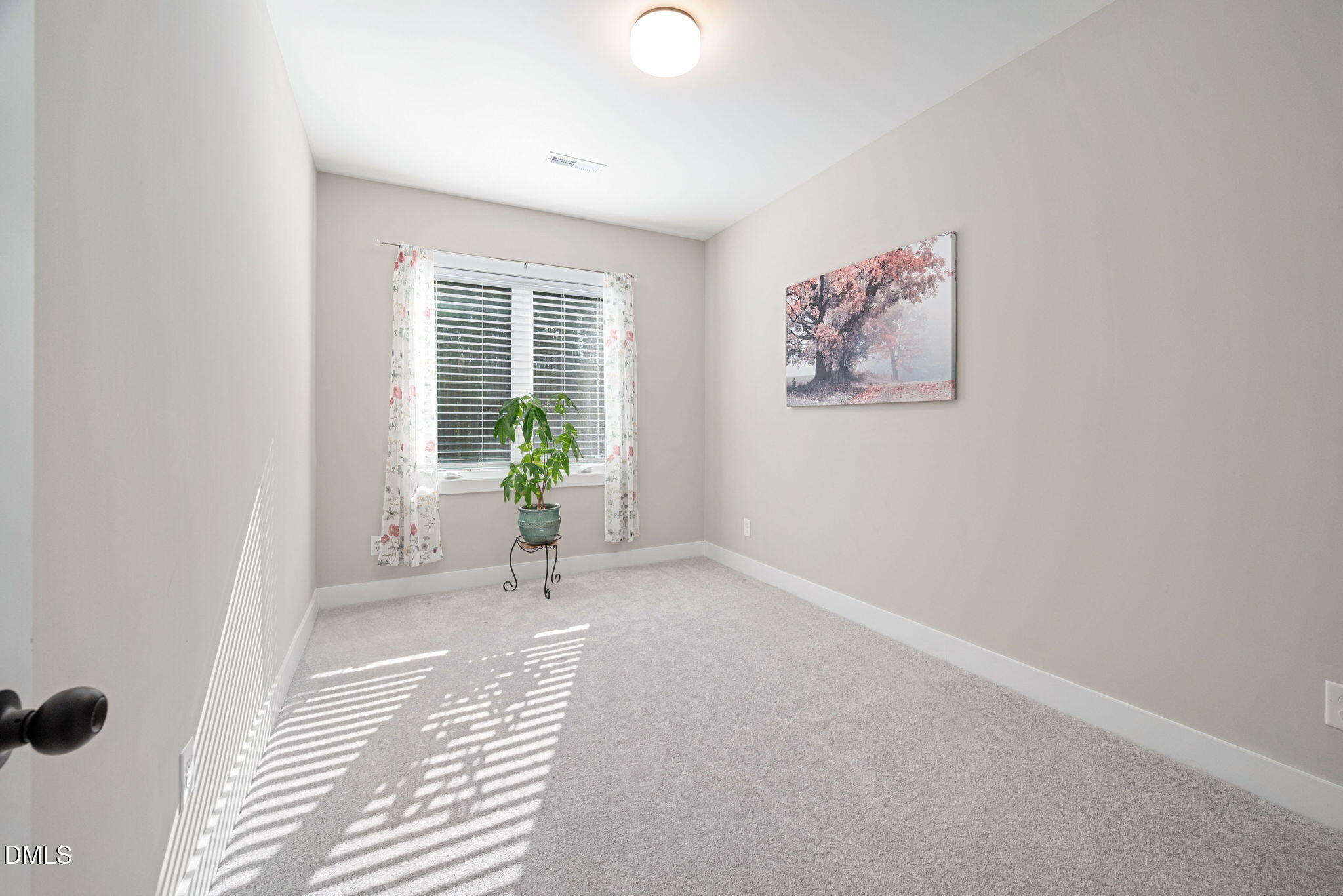 4208 Convergence Street Durham, NC 27704 - Photo 21 of 38 an empty room with windows and entrance