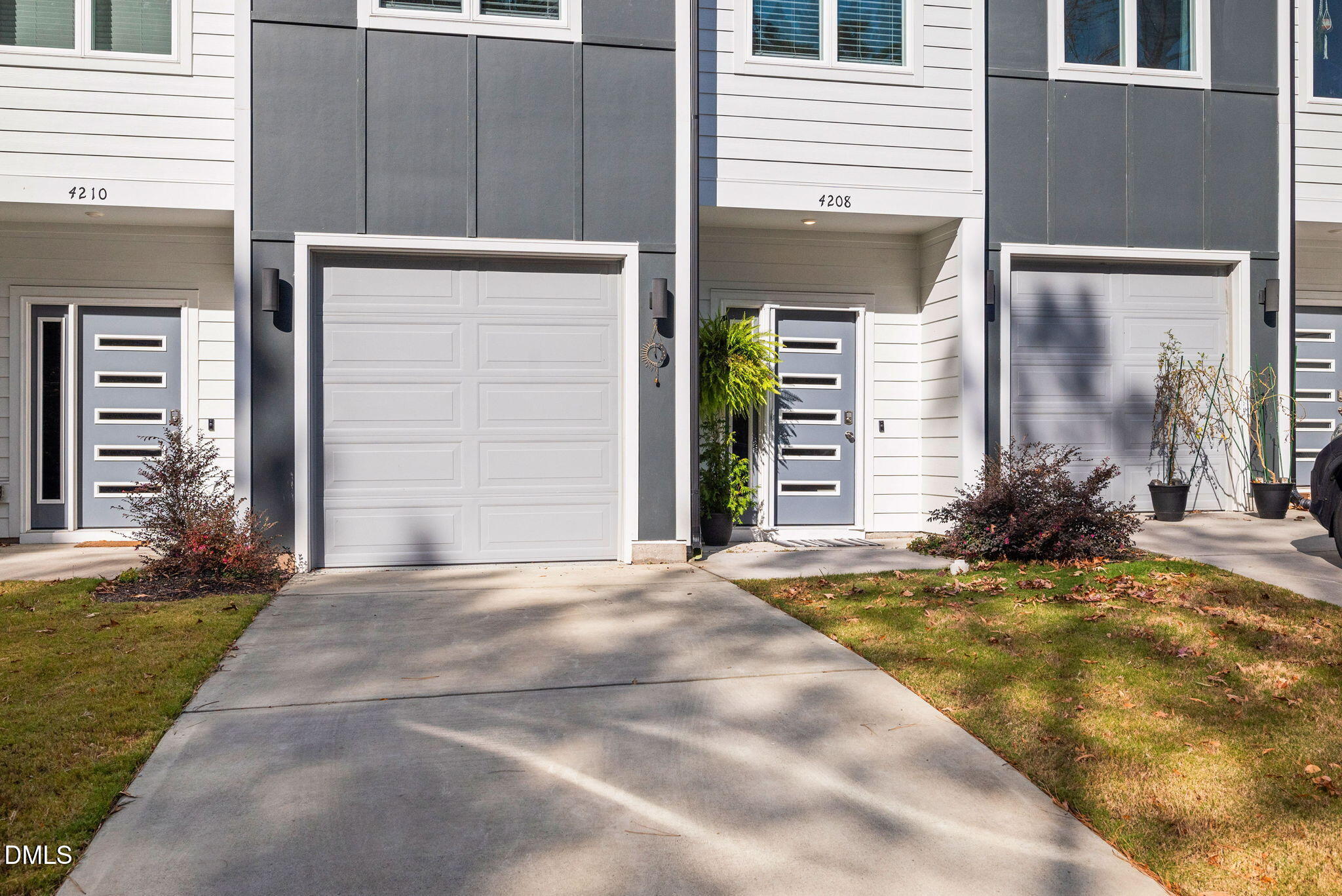 4208 Convergence Street Durham, NC 27704 - Photo 3 of 38 a view of yellow house with a outdoor space