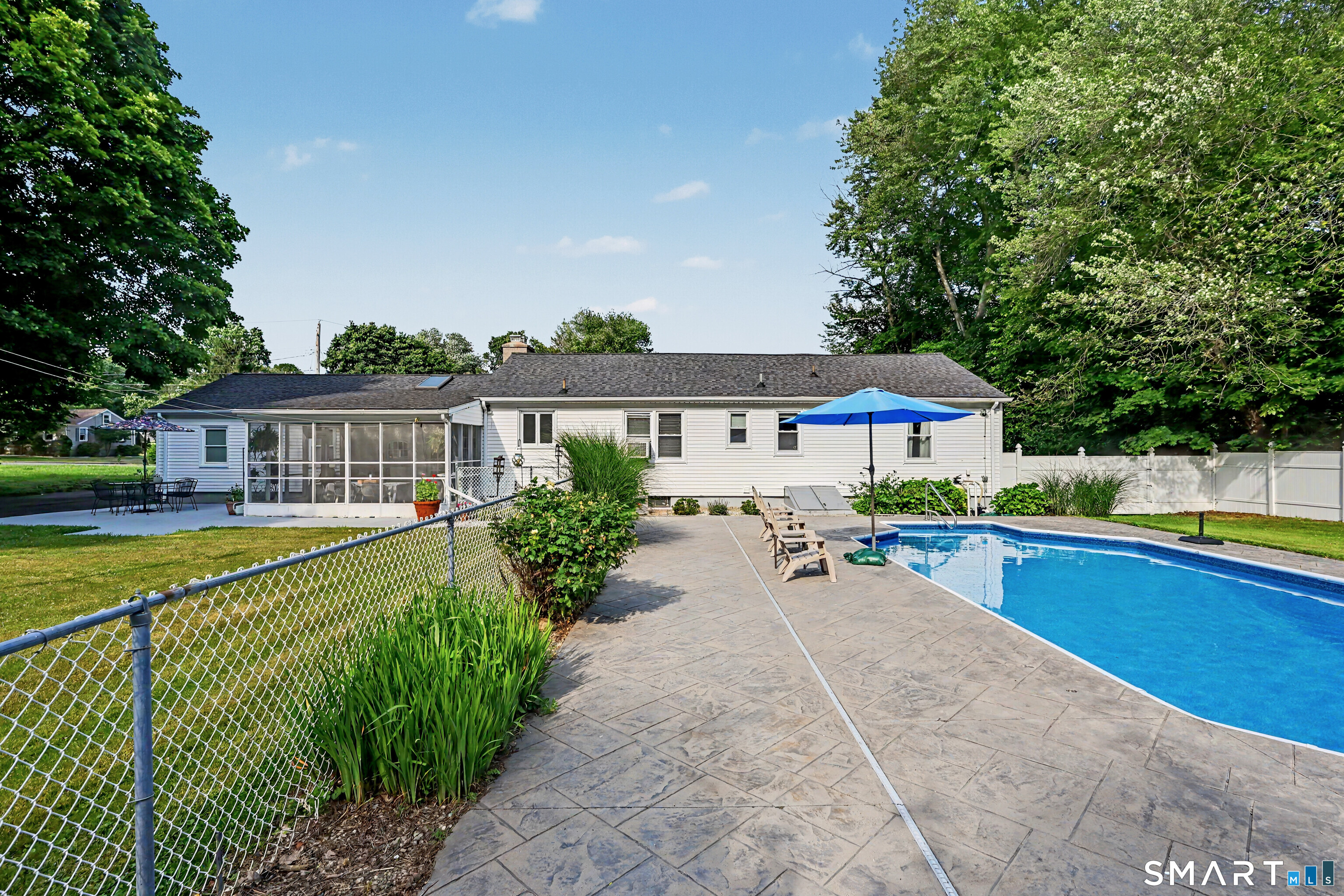524 Ferry Road Orange, CT 06477 - Photo 37 of 40 a front view of house with yard and outdoor seating