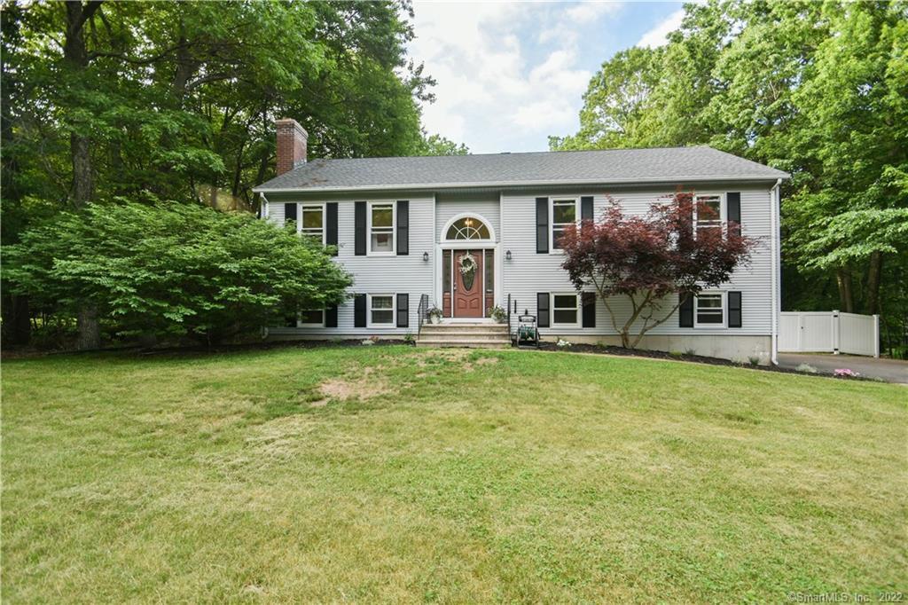 a view of a house with a backyard patio and swimming pool