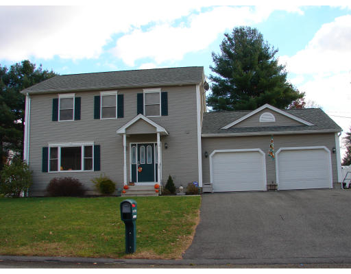 5 Tanglewood Drive Springfield, MA 01129 - Photo 1 of 19 a front view of a house with a yard and garage