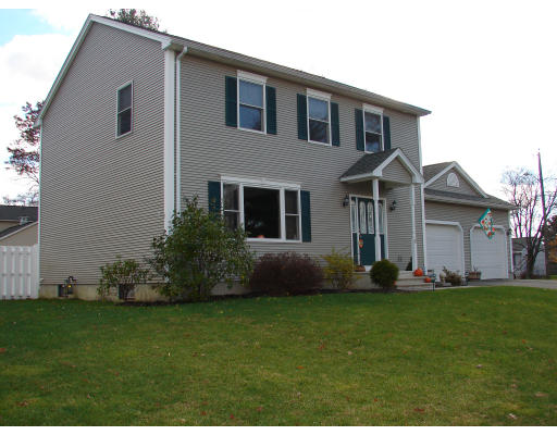 5 Tanglewood Drive Springfield, MA 01129 - Photo 17 of 19 a front view of a house with a garden and yard