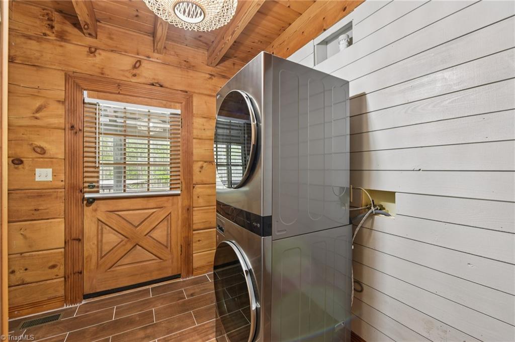 6875 Pisgah Covered Bridge Road Asheboro, NC 27205 - Photo 27 of 41 Laundry/mud room on the main level has a closet for additional storage. Door leads to back screened porch.