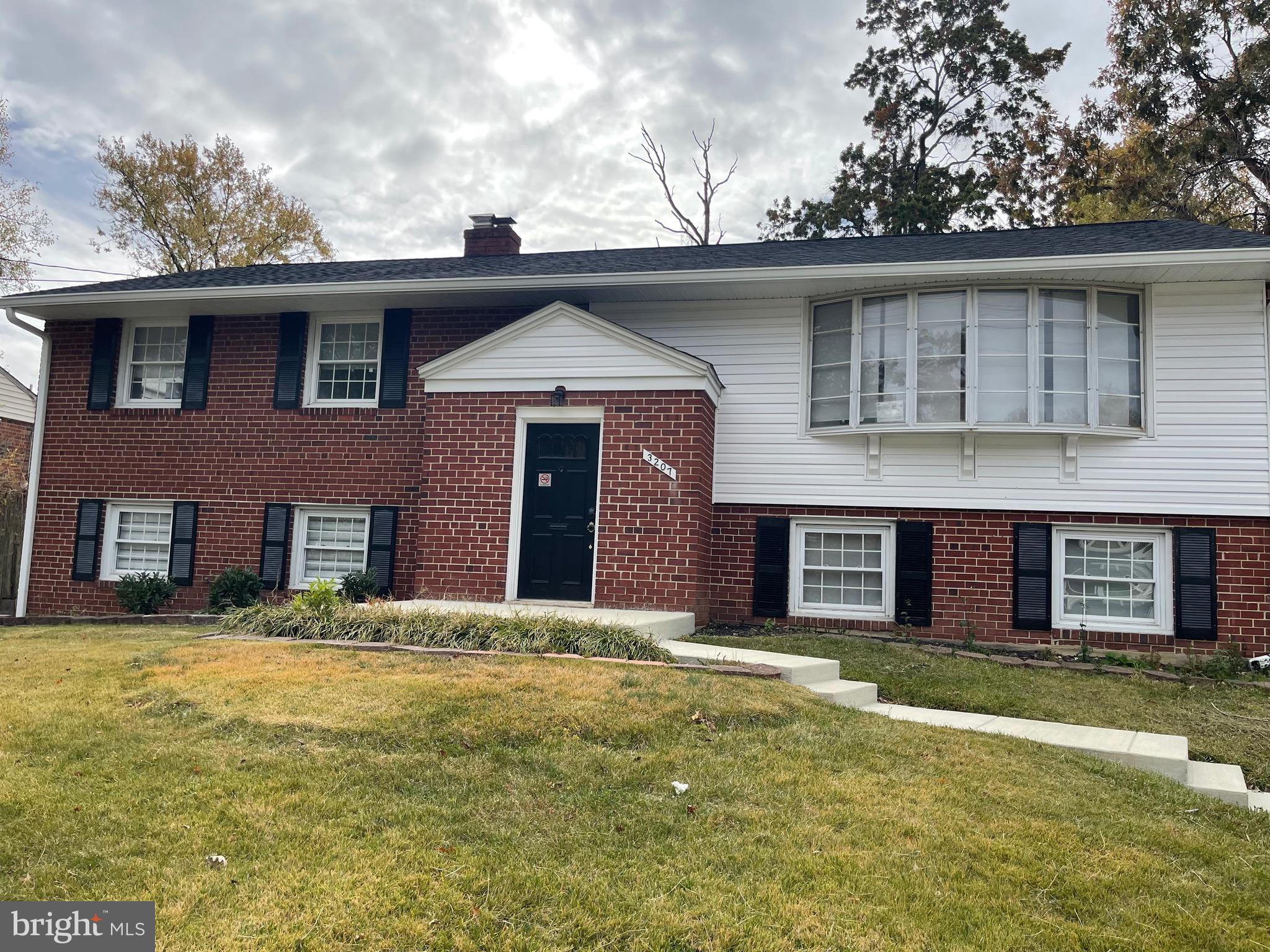 3207 # Road Beltsville, MD 20705 - Photo 1 of 25 a front view of a house with a yard