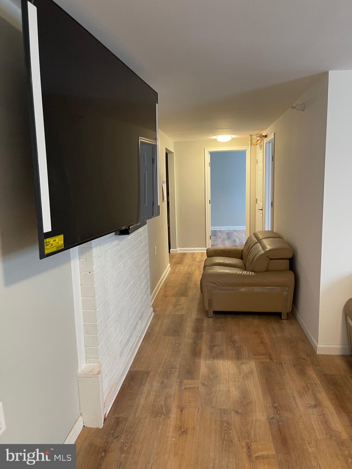 3207 # Road Beltsville, MD 20705 - Photo 11 of 25 a bedroom with a bed and a flat screen tv