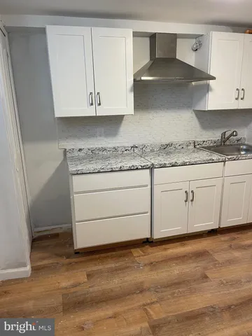 a kitchen with granite countertop cabinets and a sink