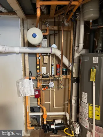 a view of walk in closet with clothes