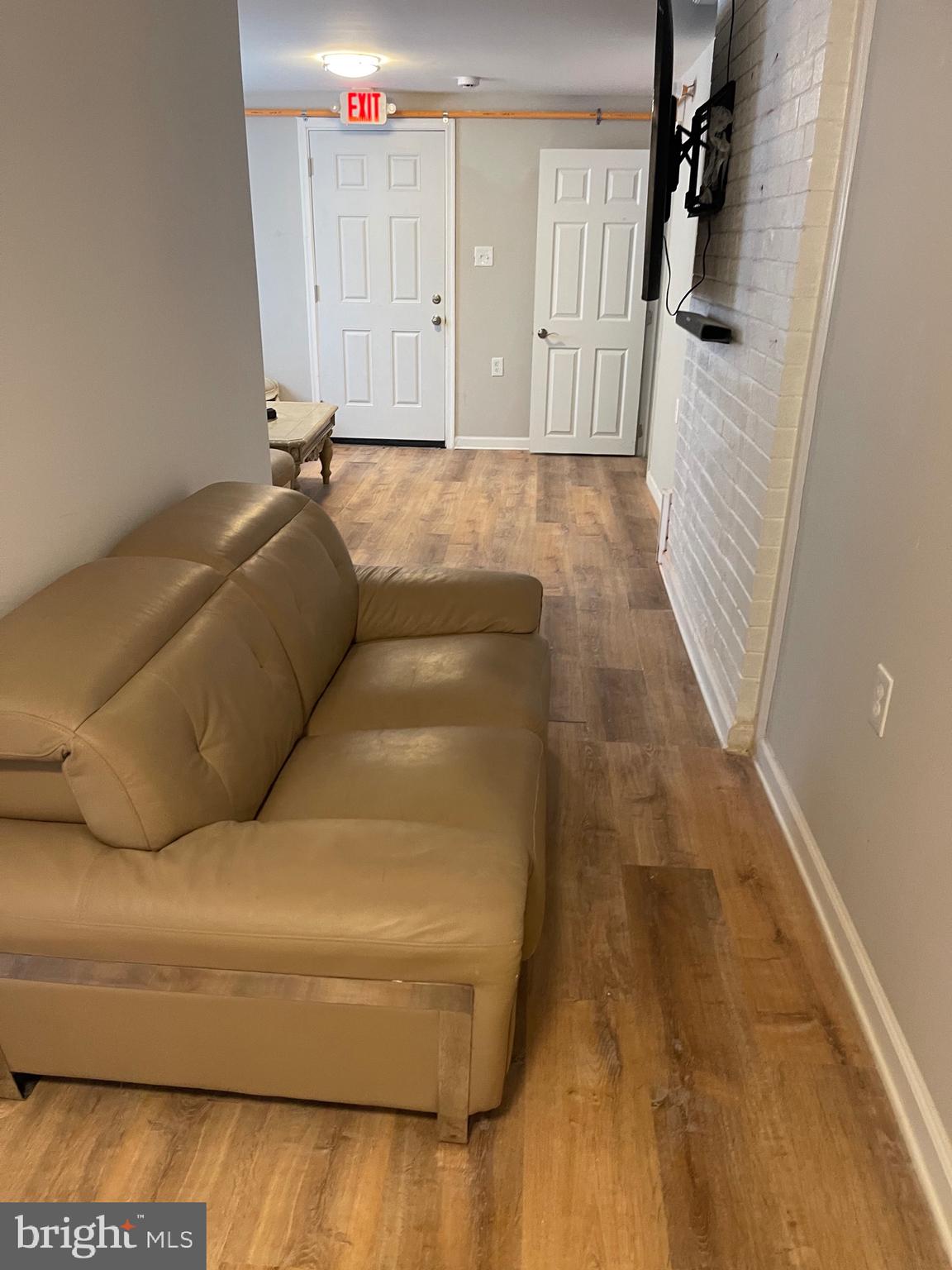 3207 # Road Beltsville, MD 20705 - Photo 9 of 25 a living room with a couch