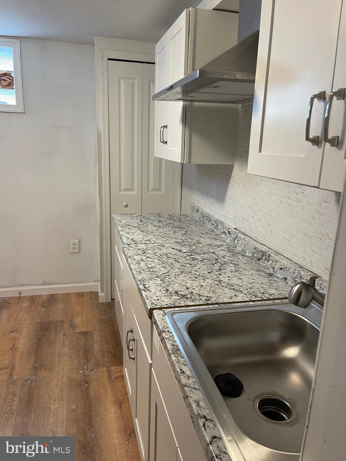 3207 # Road Beltsville, MD 20705 - Photo 10 of 25 a kitchen with a stove and a sink