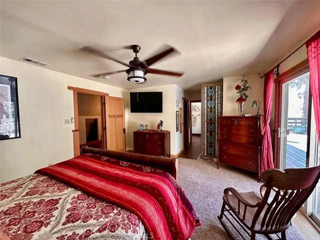 a bedroom with bed and window