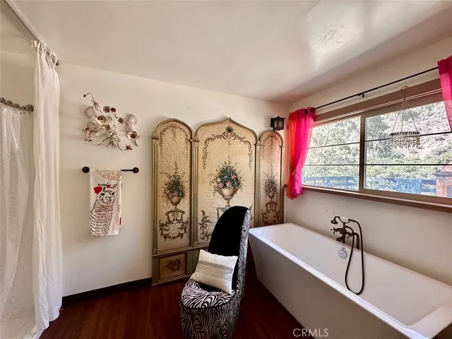 a bedroom with bed and large window