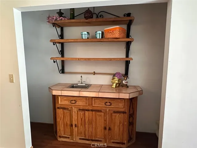 a view of living room with furniture and wooden floor