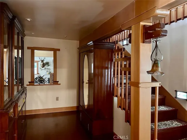 a view of a dry yard with trees