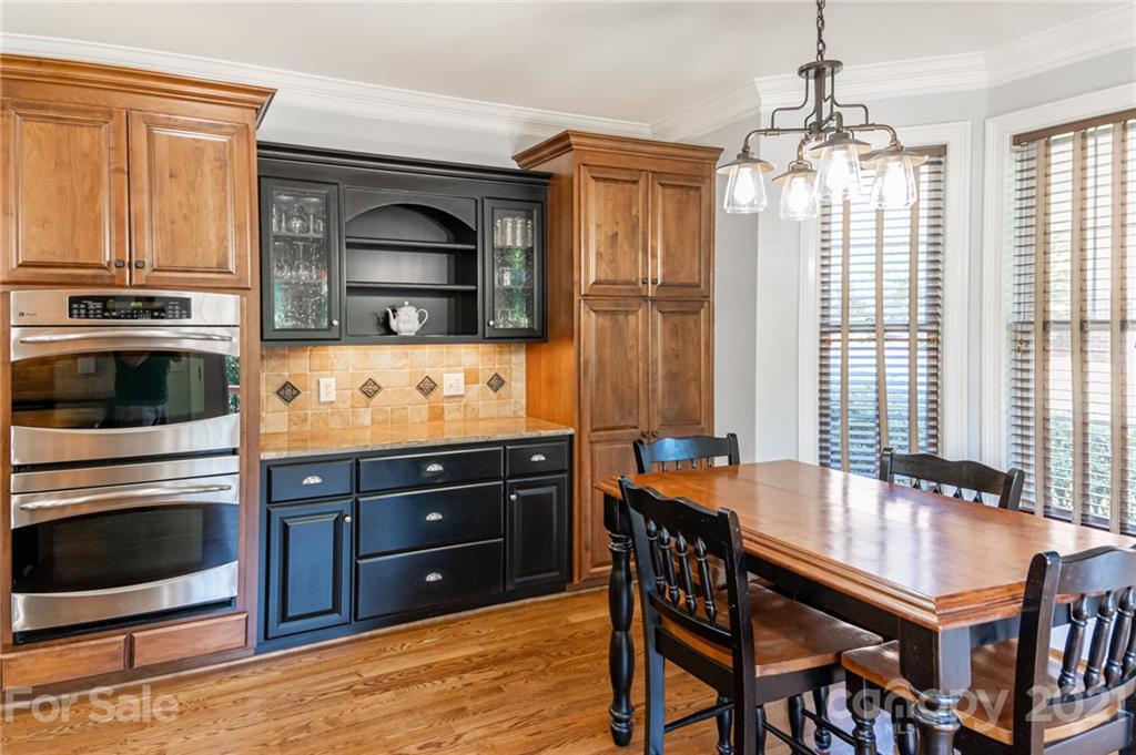6723 Fox Ridge Circle Davidson, NC 28036 - Photo 14 of 42 a kitchen with stainless steel appliances granite countertop a stove a sink and a microwave