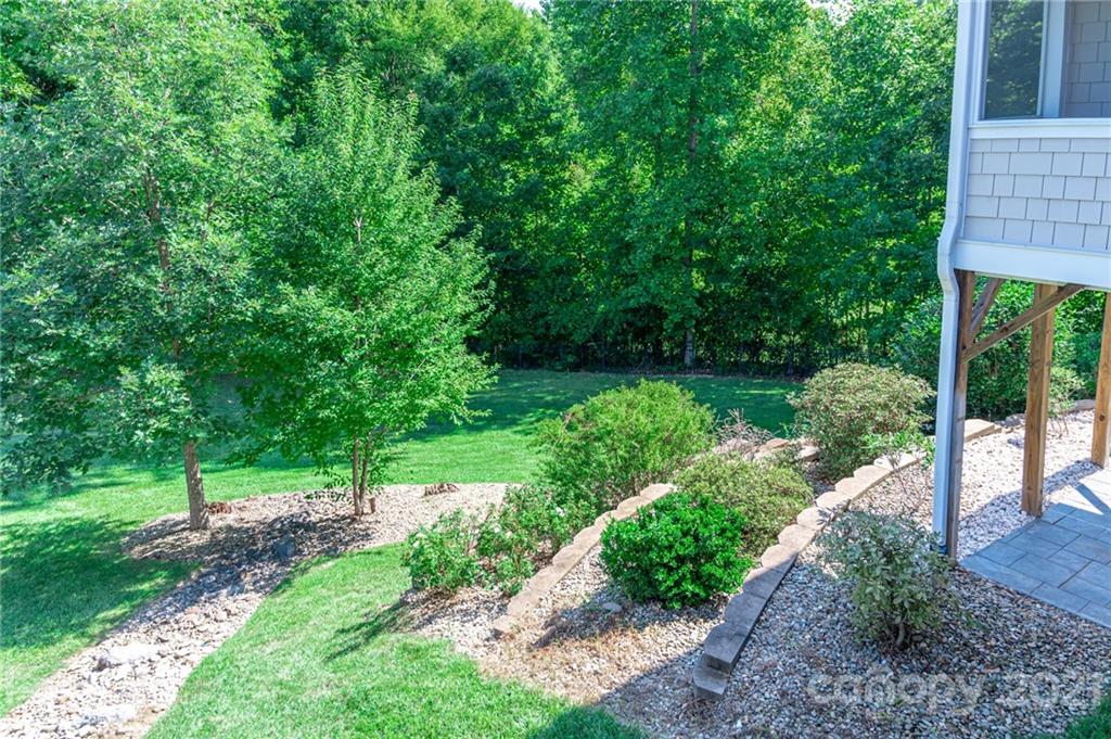 6723 Fox Ridge Circle Davidson, NC 28036 - Photo 23 of 42 a view of a garden with a building in the background
