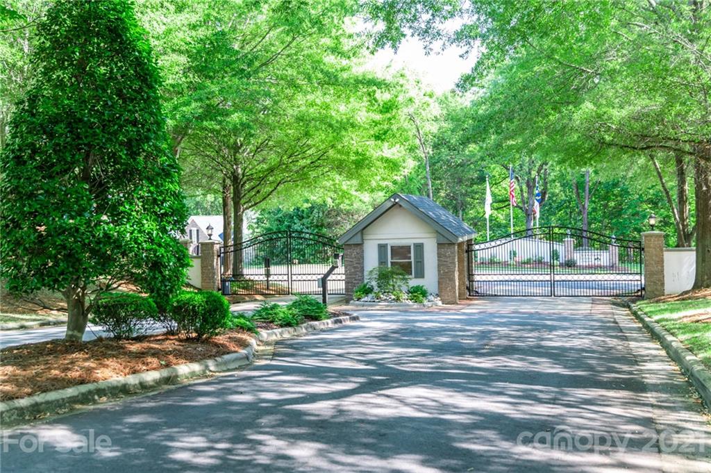 6723 Fox Ridge Circle Davidson, NC 28036 - Photo 40 of 42 a front view of a house with a yard and trees