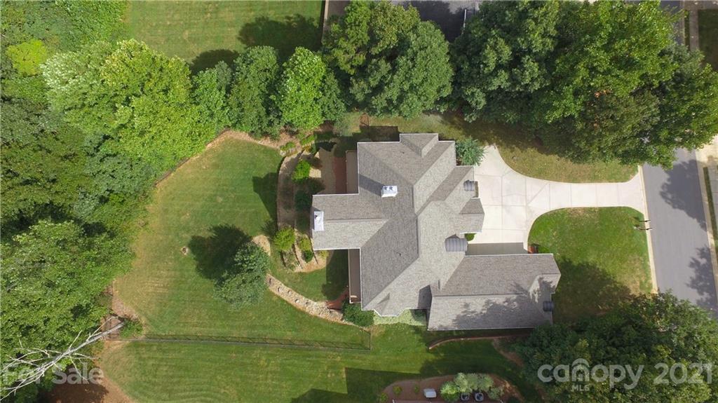 6723 Fox Ridge Circle Davidson, NC 28036 - Photo 42 of 42 an aerial view of a house with a yard and trees all around