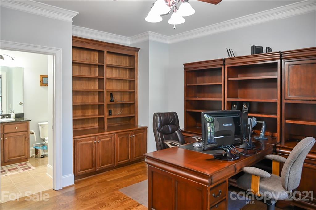 6723 Fox Ridge Circle Davidson, NC 28036 - Photo 9 of 42 a room with furniture a bookshelf and a window