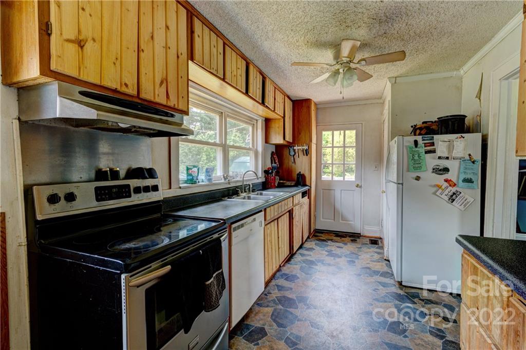 1119 Black Road Cherryville, NC 28021 - Photo 4 of 19 a kitchen with stainless steel appliances granite countertop a stove and a refrigerator