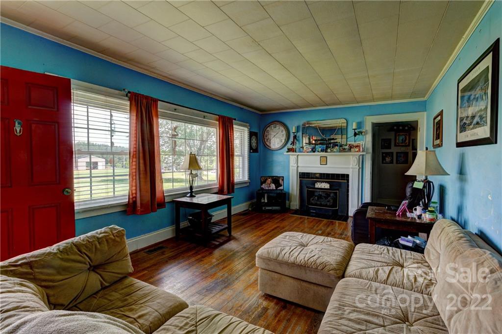 1119 Black Road Cherryville, NC 28021 - Photo 6 of 19 a living room with furniture window and a fireplace