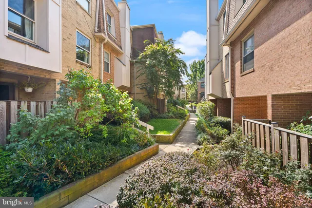 a view of a yard in front of a brick building