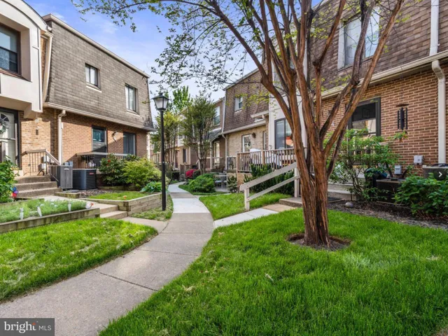 a backyard of a house with yard fire pit and outdoor seating