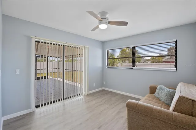a living room with furniture and a window