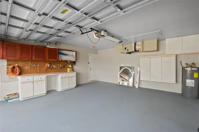 a view of a storage & utility room with cabinets