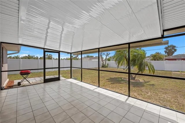 a view of an empty room with windows