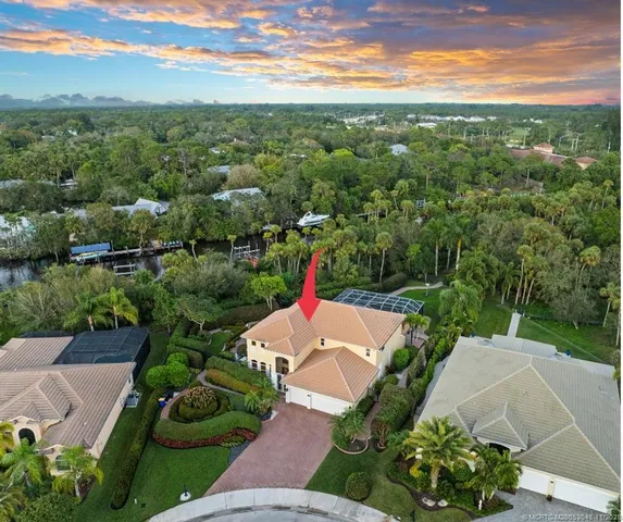 a view of a house with a garden and a yard