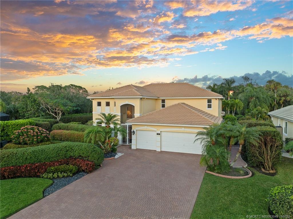 299 Southwest Lost River Road Stuart, FL 34997 - Photo 12 of 43 a view of house with a yard and potted plants