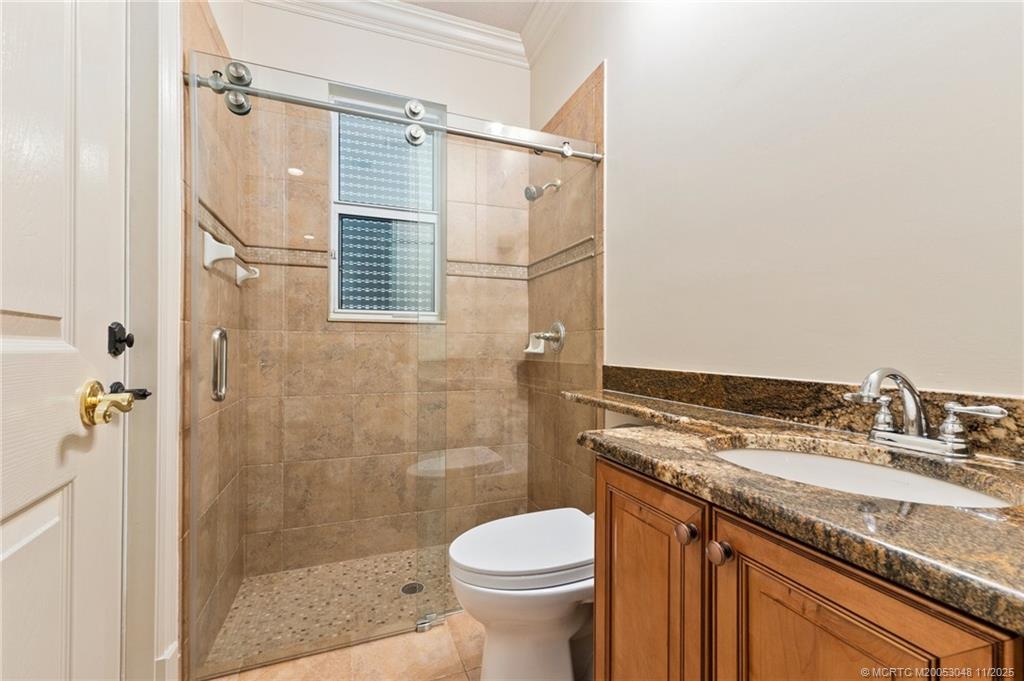 299 Southwest Lost River Road Stuart, FL 34997 - Photo 19 of 43 a bathroom with a granite countertop sink toilet and shower