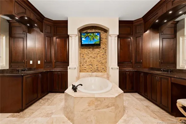 a bathroom with a sink and a large mirror