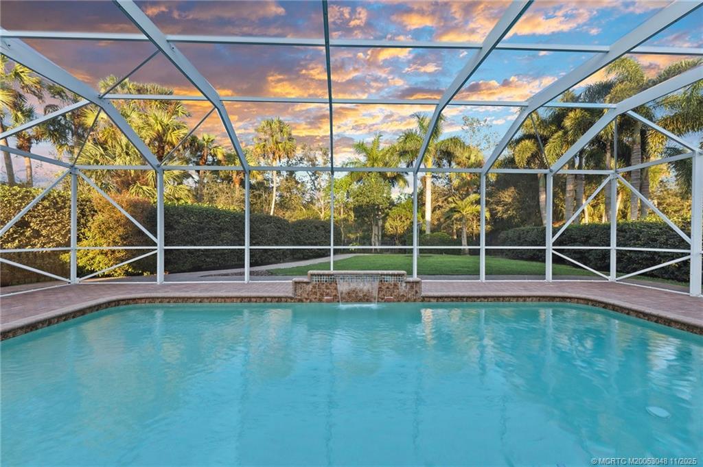 299 Southwest Lost River Road Stuart, FL 34997 - Photo 26 of 43 a view of a backyard with table and chairs