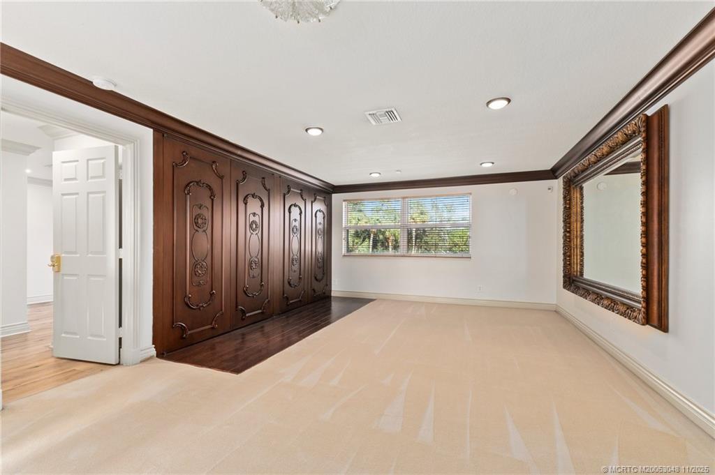 299 Southwest Lost River Road Stuart, FL 34997 - Photo 27 of 43 an empty room with windows and closet