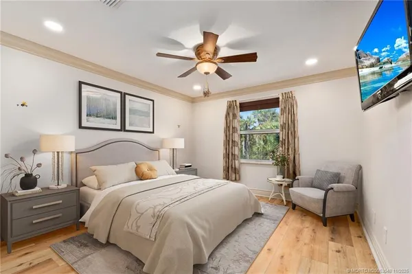 a bedroom with a bed couch and window