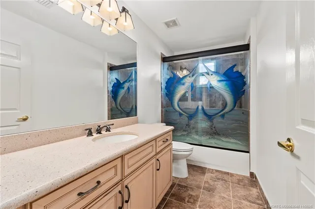 a bathroom with a sink a vanity and a mirror