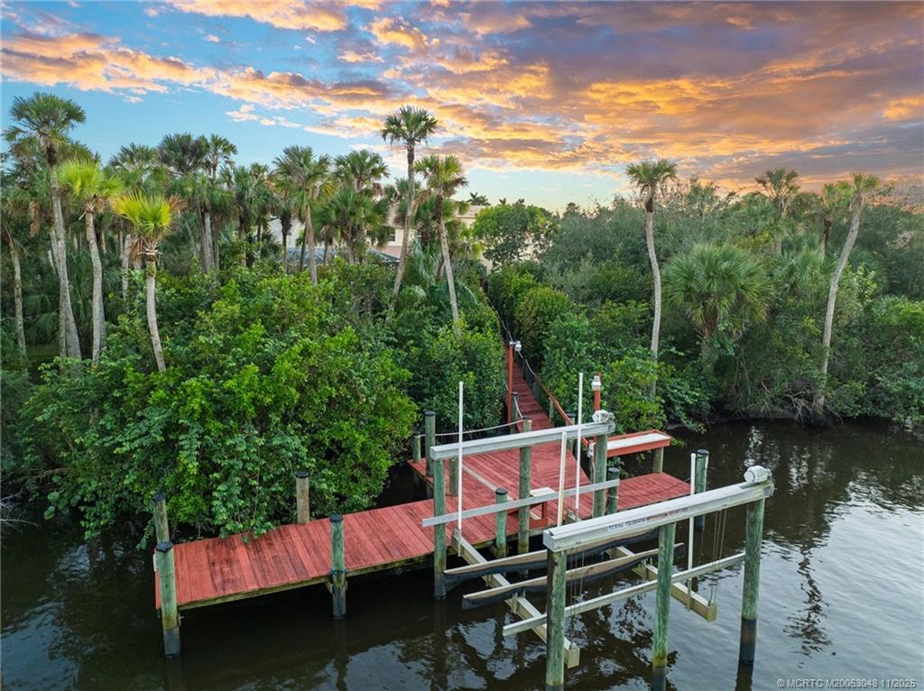 299 Southwest Lost River Road Stuart, FL 34997 - Photo 4 of 43 a view of a chairs and table on the terrace
