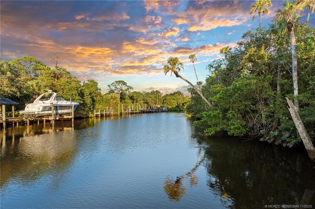299 Southwest Lost River Road Stuart, FL 34997 - Photo 42 of 43 a view of a lake with houses