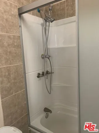 a view of a kitchen with a sink and a microwave