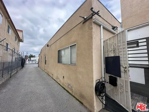 a view of a house with a street