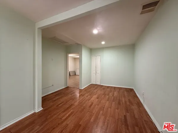 a view of an empty room and a window