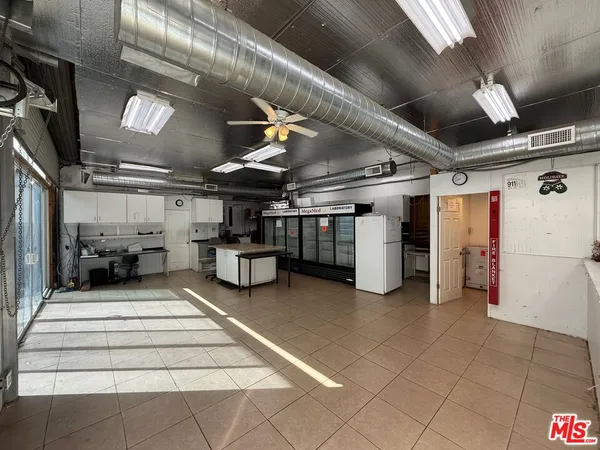 a room with lots of furniture and a chandelier