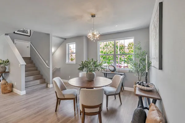 a dining room with furniture window wooden floor
