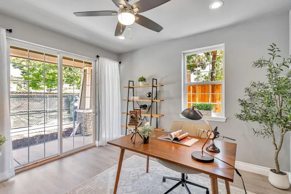 a living room with furniture and a window