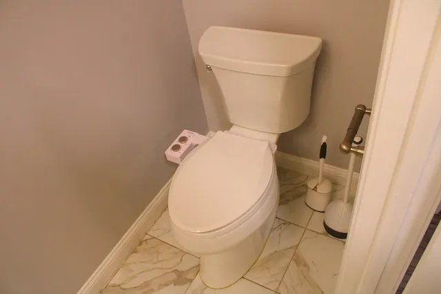 a bathroom with a toilet and a sink