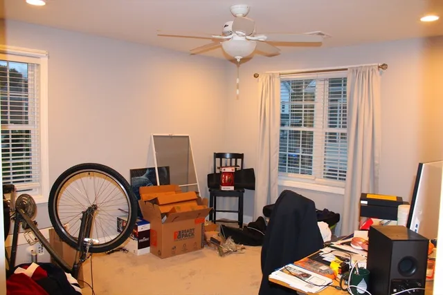 a bedroom with furniture and a window