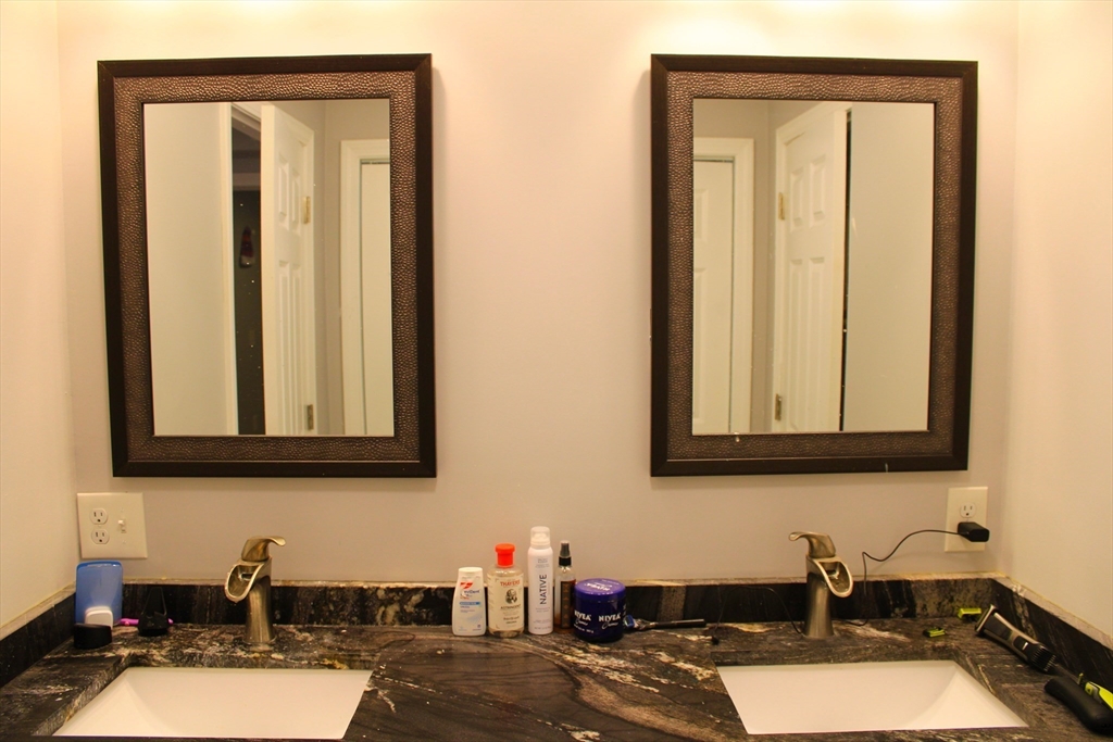 10 North Court Street, Unit 3 Fall River, MA 02720 - Photo 21 of 26 a bathroom with a sink and a mirror