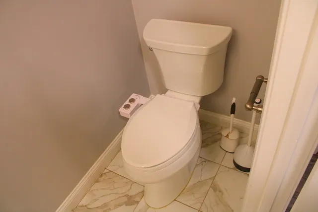 a bathroom with a toilet and a sink