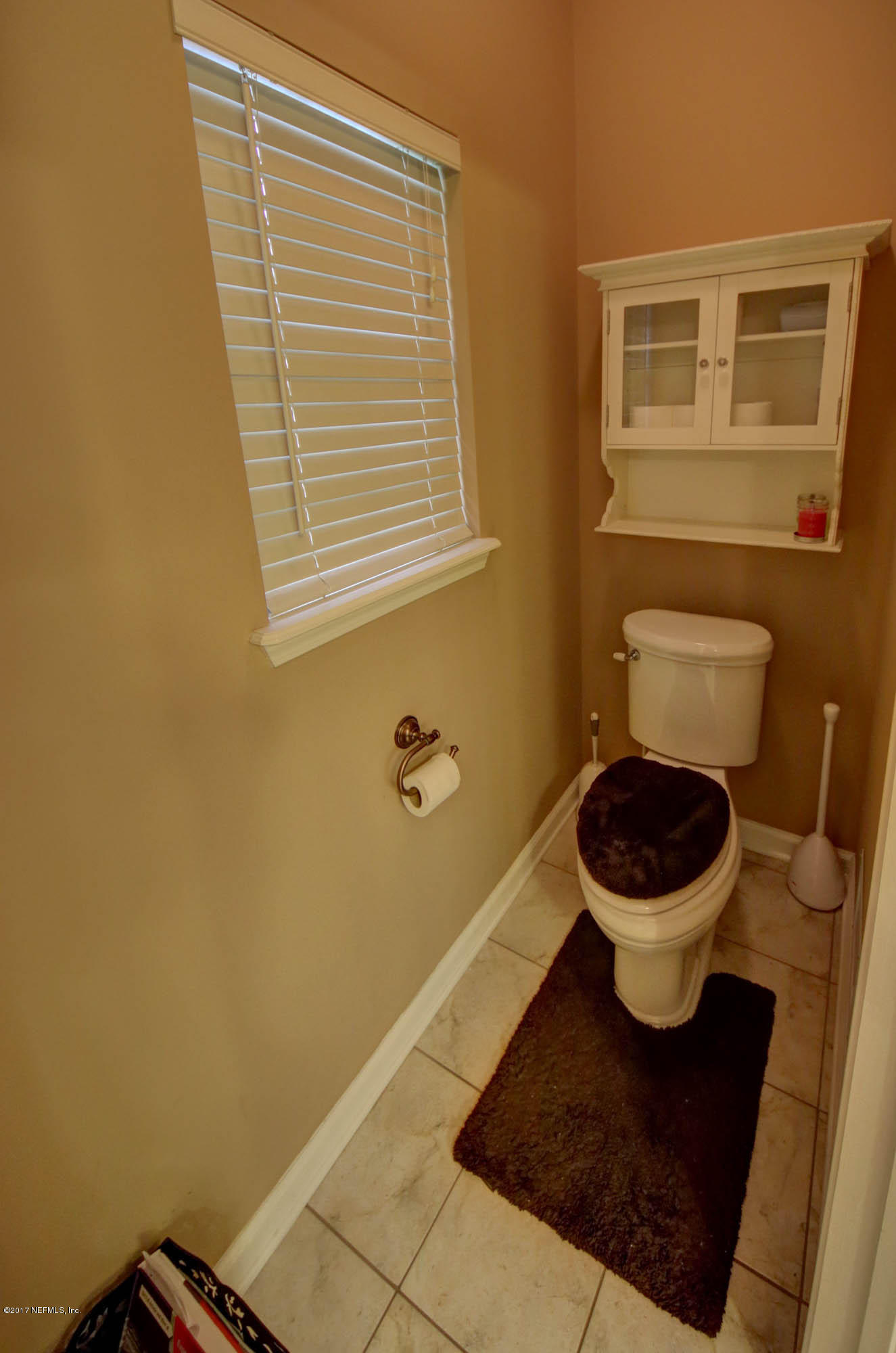1302 Sinclair Lane Jacksonville, FL 32221 - Photo 18 of 32 a bathroom with a toilet and a sink